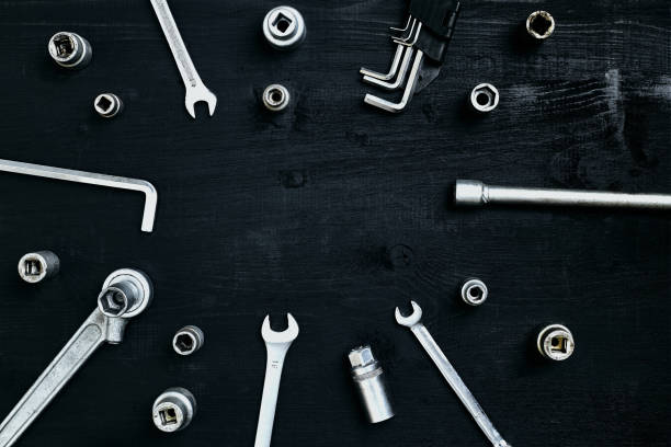 istock Tools for work or repair auto on black wooden background. Top view 913241104