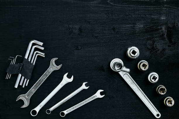 istock Tools for work or repair auto on black wooden background. Top view 913243526