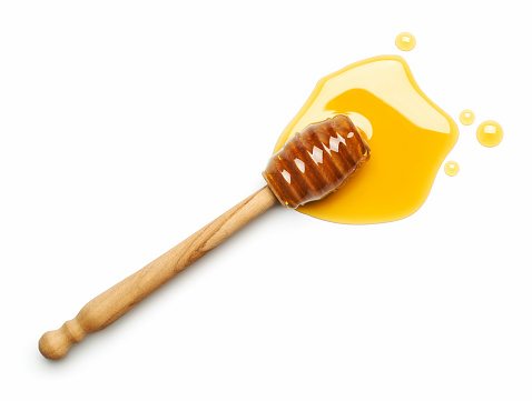 Honey dipper on white background - Top view
