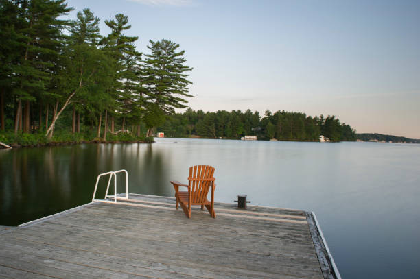 istock Muskoka chair on wood dock 913246004