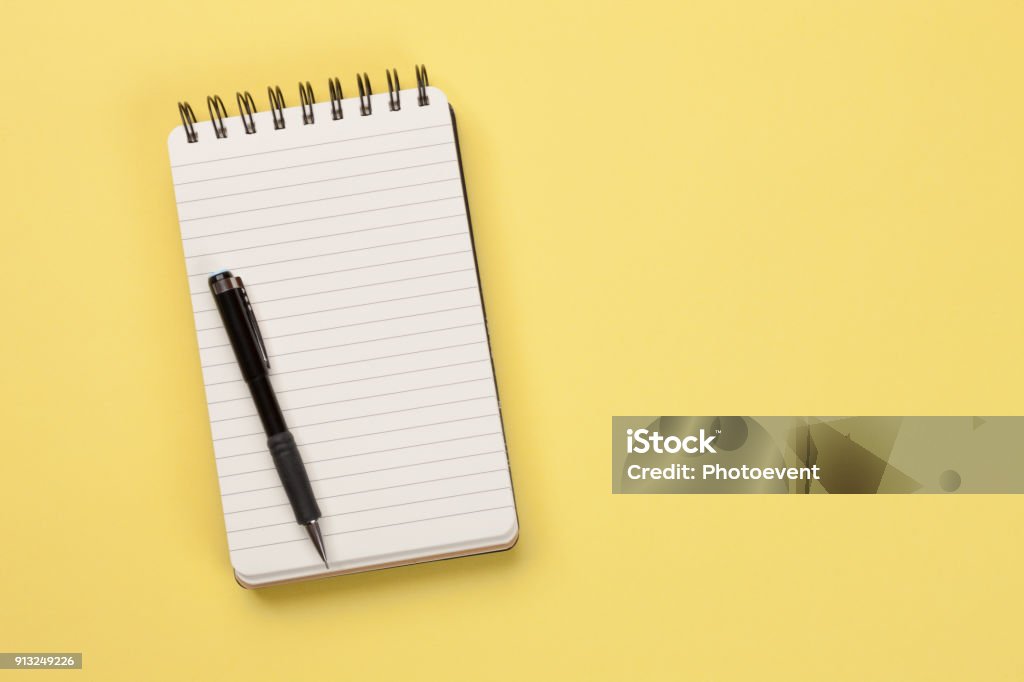 To do list - Concept Spiral Notebook isolated on yellow background To Do List Stock Photo