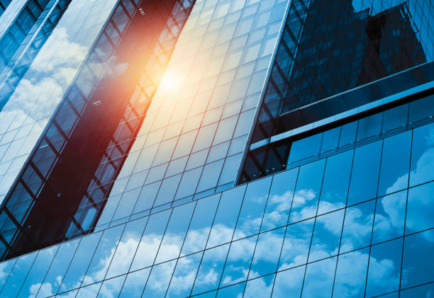 Skyscraper or modern building in the city with cloud and sunlight