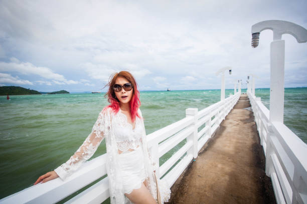 istock A woman on the pier bridge 913265414