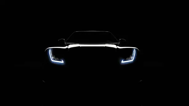 Photo of silhouette of black sports car on black