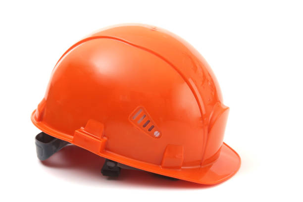 istock worker orange hard hat on white background. Safety helmet. 913278938