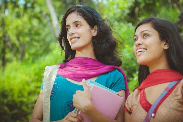 istock Two female Indian college students from rural background. 913279620