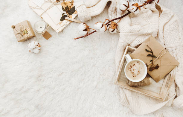 Winter cozy background with cup of coffee, warm sweater and old letters. Flat lay for bloggers stock photo