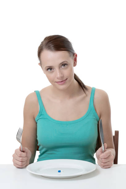 istock woman eatting tablet 913280382