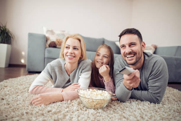 istock Young family having fun at home 913284272