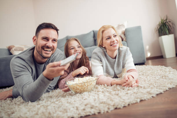 istock Young family having fun at home 913284324