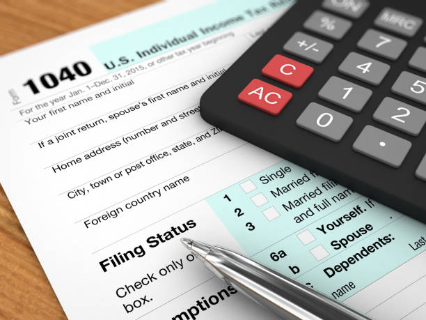 istock Tax form payment desk top view 913284702