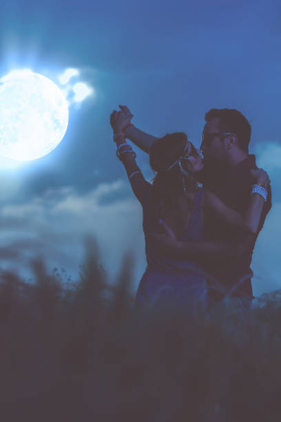 istock Couple dancing under the moonlight in nature. My astronomy work. 913285122