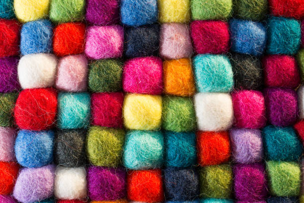 istock Geometric background with balls of colored synthetic wool 913285164
