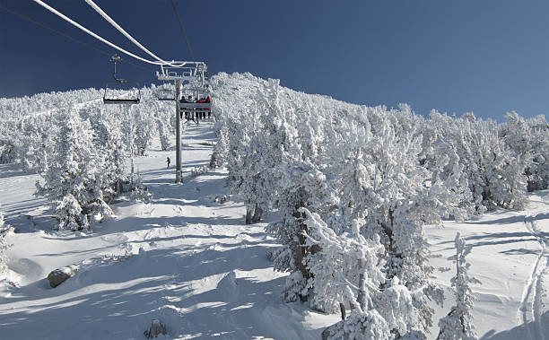 Riding a lift at ski resort 2 stock photo