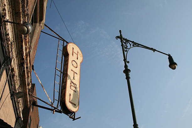 istock Derelict Hotel Sign And Lamp Post 91328936