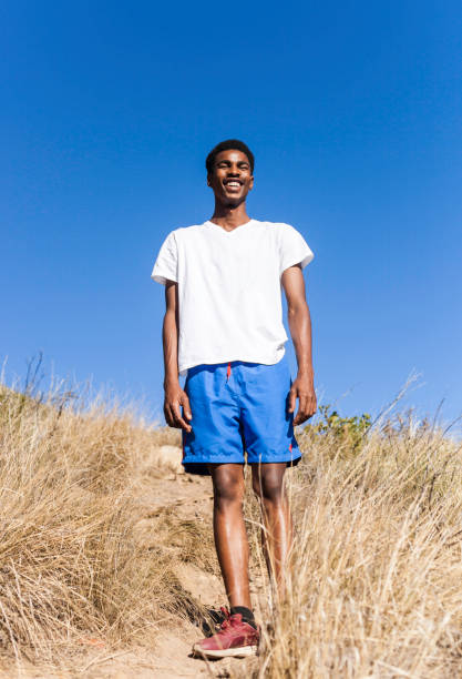 istock Young man on the mountain with a big smile. 913292308
