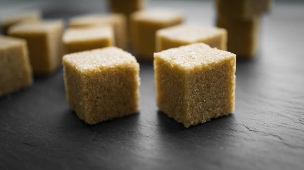istock sugar cubes on a dark background. close up view 913292742
