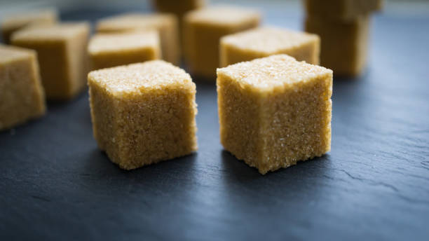 istock sugar cubes on a dark background. close up view 913292746