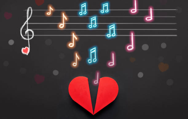 istock Music notes and note scale above red heart box, Valentines Day concept 913295578