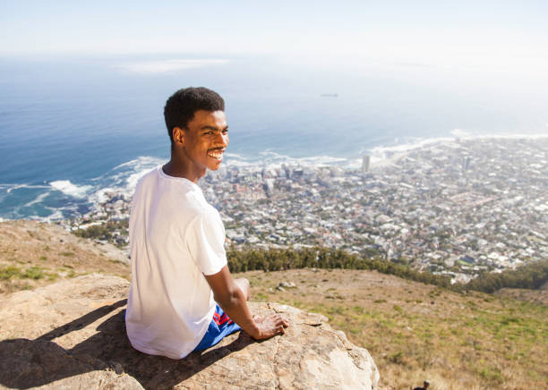 istock Sitting on a rock looking at the view. 913295716
