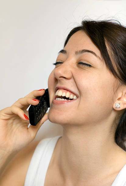 istock young girl at phone 91330851