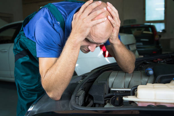 istock Young car service technician who repair the car engine motor. 913312448
