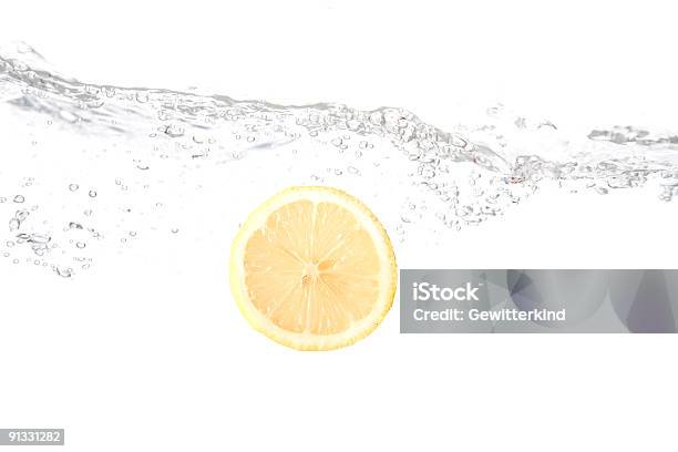 Splashing Lemon Stock Photo - Download Image Now - Bubble, Cleaning, Color Image