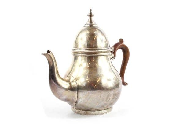 Silver Metal Ornate Tea Pot on White Background stock photo