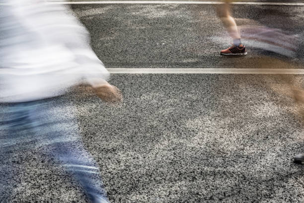 istock People running in marathon on city streets. Motion blur. 913315070