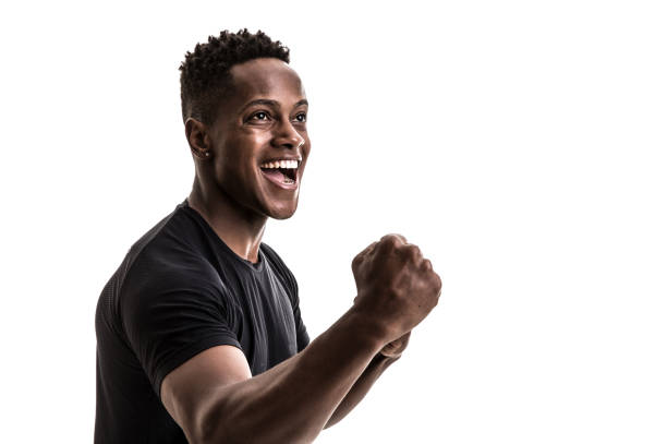 Afro male athlete / fan celebrating on white background