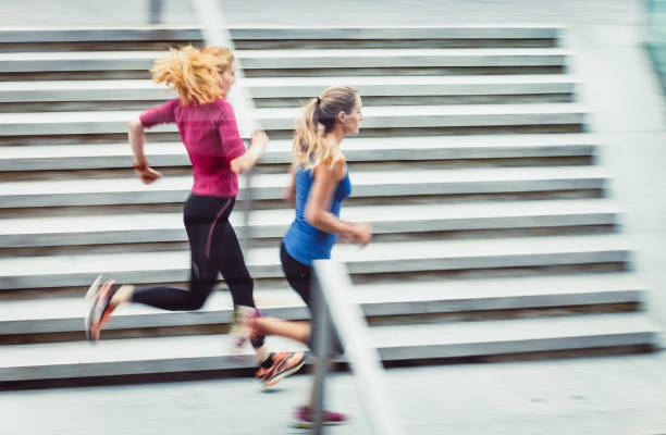 istock Two Female Athletes Running Outdoors, Blurred motion 913323434