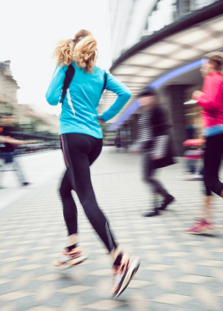 istock Two Female Athletes Running Outdoors, Blurred motion 913323548