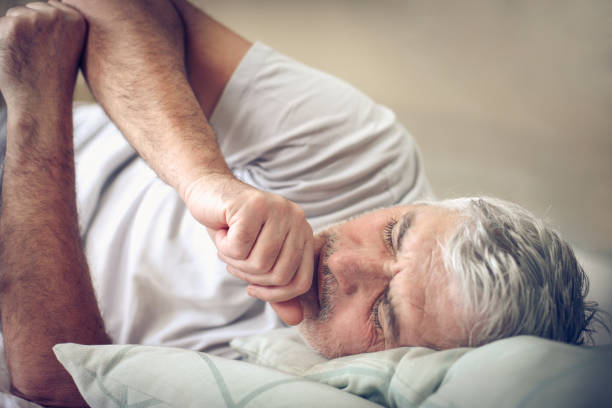 istock Sick senior man in bed. 913323674