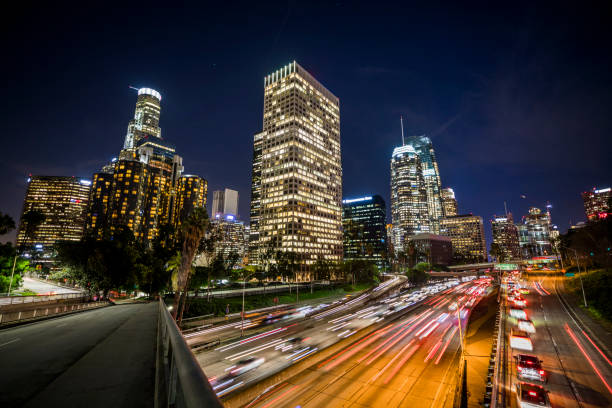 istock Highway and Los Angeles city skyline at night 913327962
