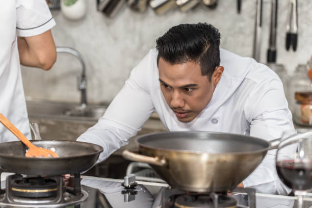 istock Asian handsome Chef preparing for cooking food in restaurant 913331832