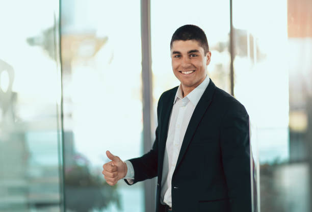 istock Handsome buisnessman showing thumbs up 913332140