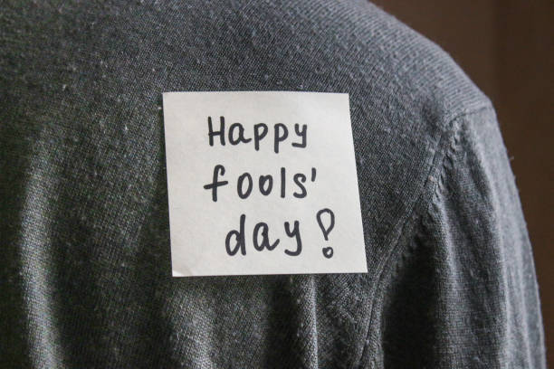 istock A note on the back of a young man with a comic text. A joke by the first of April. 913334518