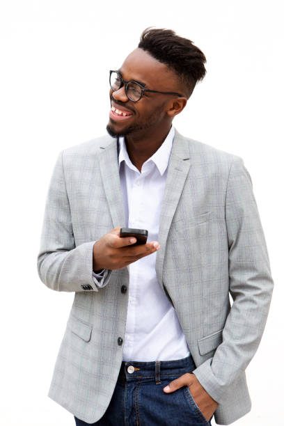 istock young businessman with mobile phone smiling against white background 913338290