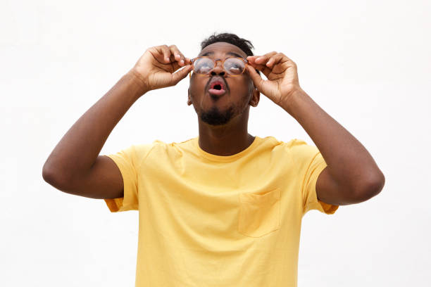istock young black man with glasses looking up 913338308