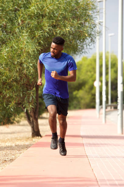 istock healthy young african man running outside 913338364