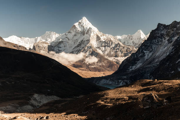 istock Ama Dablam mountain. Sun illuminates slopes. Himalayan mountains, Nepal. 913339118