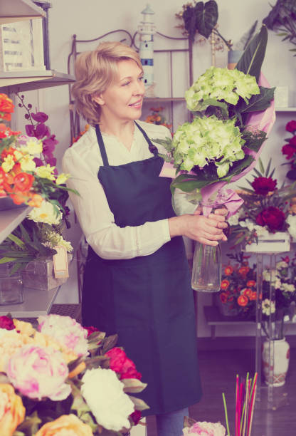 istock Florist with fresh flowers 913339560