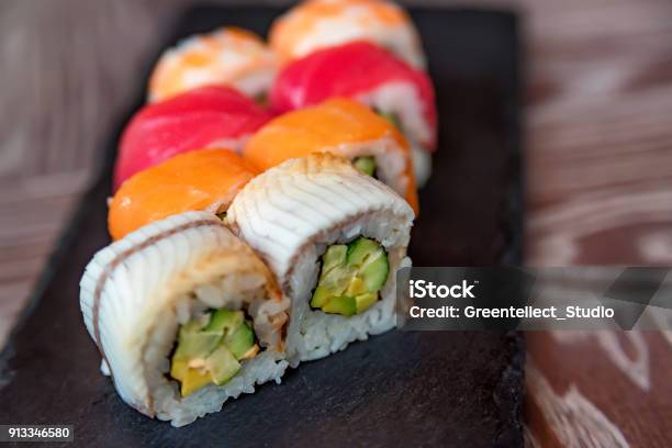 Rainbow Sushi Roll On Tray Close Up Stock Photo - Download Image Now - Sushi, Avocado, Blossom