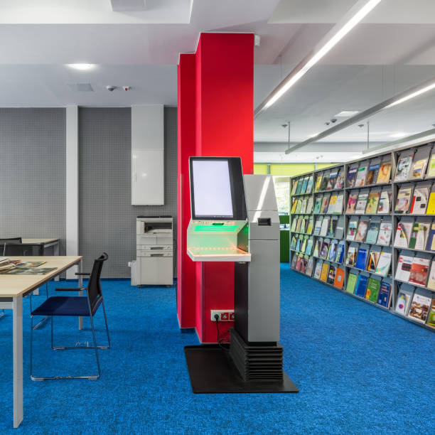 Library with self-check device Library interior with bookshelves and self-check lending books device giant cube stock pictures, royalty-free photos & images