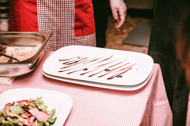 istock Table at cooking workshop with plates and food 913354338