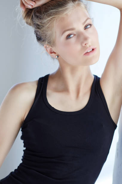 istock Blond woman in black shirt. 913354970