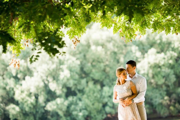 istock Loving couple in the spring park 913355448