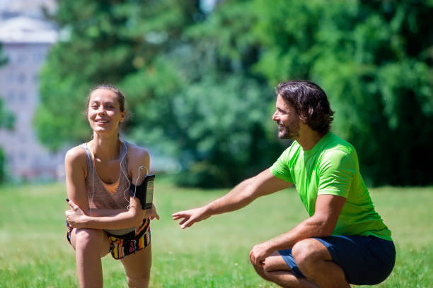 istock Young couple having training in the park 913355642