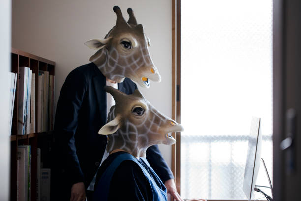 Giraffe heads man and woman working from home