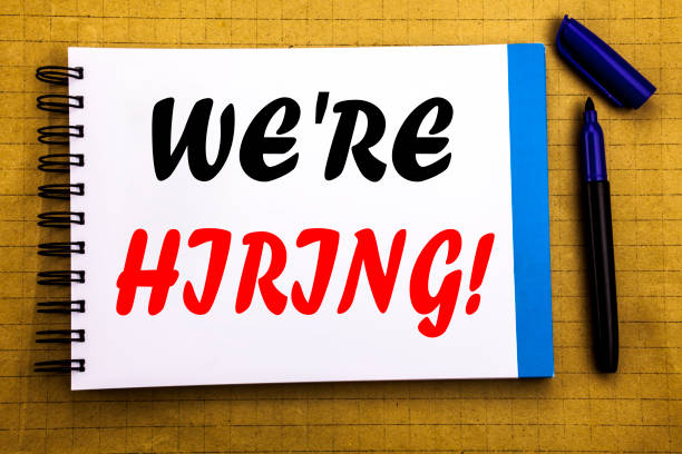istock We Are Hiring Now. Business concept for Recruitment Human Resources  Written on notepad note paper background with space office view with pencil marker 913360210